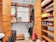 Walk-in closet with custom wood shelving and ample space for storage and organization at 23485 Bluestem Dr, Golden, CO 80401