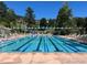 Outdoor community pool featuring multiple swimming lanes and lounge chairs at 23485 Bluestem Dr, Golden, CO 80401
