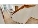 Carpeted staircase with wooden handrail, leading to the next level of the home at 23485 Bluestem Dr, Golden, CO 80401