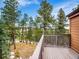 Beautiful yard view from the deck, highlighting the home's wooded surroundings and peaceful setting at 23485 Bluestem Dr, Golden, CO 80401