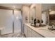 Clean and modern bathroom with double vanity, walk-in shower, and stylish fixtures at 495 Bennett Ave, Bennett, CO 80102