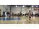 Indoor gymnasium featuring volleyball players in mid-game on a well-lit, polished court at 495 Bennett Ave, Bennett, CO 80102