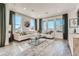 Inviting living room with large windows, comfortable seating, and stylish decor at 495 Bennett Ave, Bennett, CO 80102