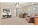 Finished basement featuring plush carpeting, entertainment center, and comfortable seating arrangement at 1762 Granger Cir, Castle Rock, CO 80109