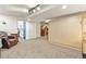 Spacious basement with neutral carpeting and a Murphy bed for flexible living space at 1762 Granger Cir, Castle Rock, CO 80109