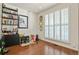 Bright bedroom featuring large windows, hardwood floors, and stylish decor, offering a serene retreat at 1762 Granger Cir, Castle Rock, CO 80109