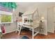Unique bedroom with a playful house-shaped bed, ladder, and decor, creating a whimsical space at 1762 Granger Cir, Castle Rock, CO 80109