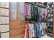 Custom walk-in closet with built-in drawers, shelving, and racks for organized storage at 1762 Granger Cir, Castle Rock, CO 80109