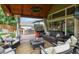 Inviting covered patio with comfortable seating, outdoor grill, and serene backyard view at 1762 Granger Cir, Castle Rock, CO 80109