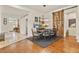 Elegant dining area with hardwood floors, modern lighting, and a unique barn door feature, perfect for gatherings at 1762 Granger Cir, Castle Rock, CO 80109