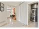 Inviting entryway leading to a modern laundry room with stacked washer and dryer for convenience at 1762 Granger Cir, Castle Rock, CO 80109