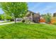 Inviting home showcasing a large, well-maintained lawn and attractive front yard landscaping at 1762 Granger Cir, Castle Rock, CO 80109