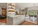 Bright, open kitchen with white cabinetry, marble countertops, and modern appliances at 1762 Granger Cir, Castle Rock, CO 80109