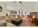 Open concept living room connects to kitchen, dining area, and features a fireplace with modern finishes at 1762 Granger Cir, Castle Rock, CO 80109