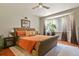 Serene main bedroom with hardwood floors, bay window, and ample natural light at 1762 Granger Cir, Castle Rock, CO 80109