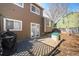 Backyard showcasing the deck, wood siding, and a small dog house at 2986 S Fundy Ct, Aurora, CO 80013