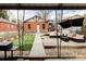 Backyard with a paved patio, outdoor seating, and a manicured lawn at 680 S Ogden St, Denver, CO 80209