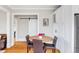 Dining room featuring a farmhouse style table and a view of the kitchen at 680 S Ogden St, Denver, CO 80209