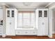 Built-in bench with window, custom cabinets, and natural light in the dining area at 680 S Ogden St, Denver, CO 80209