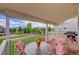 Inviting covered back deck with outdoor furniture and a grill, perfect for entertaining or relaxing outdoors at 4864 Harness Ct, Parker, CO 80134
