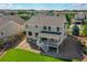Back of home showing a well-maintained yard, deck, and attractive exterior finishes at 4864 Harness Ct, Parker, CO 80134
