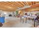Unfinished basement with concrete floor and exposed wood ceiling, offering potential for customization at 4864 Harness Ct, Parker, CO 80134