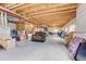 Large unfinished basement with exposed ceiling beams, offering ample space for storage or future expansion at 4864 Harness Ct, Parker, CO 80134