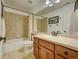 Traditional bathroom with a vanity and a shower-tub combination at 4864 Harness Ct, Parker, CO 80134