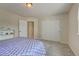 Neutral bedroom with a sliding-door closet and soft carpet at 4864 Harness Ct, Parker, CO 80134