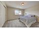 Cozy bedroom featuring a comfortable bed, a window, and neutral wall color at 4864 Harness Ct, Parker, CO 80134