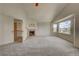Large bonus room that includes a fireplace and windows with a view at 4864 Harness Ct, Parker, CO 80134
