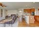 Gourmet kitchen boasts a breakfast bar and seamless flow to the living room at 4864 Harness Ct, Parker, CO 80134