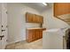 A charming laundry room that includes lots of cabinet space and a laundry sink at 4864 Harness Ct, Parker, CO 80134