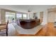 Cozy living room boasts large windows and opens to a patio at 4864 Harness Ct, Parker, CO 80134