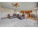Spacious living room showcases an open concept and seamless flow to the kitchen at 4864 Harness Ct, Parker, CO 80134