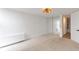 Bedroom featuring mirrored closet doors and a modern ceiling light fixture at 2500 S York St # 204, Denver, CO 80210