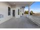 View of back porch with white railings, columns and view of pasture with white fence at 34427 Columbine W Trl, Elizabeth, CO 80107