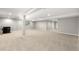 Spacious finished basement with neutral carpeting, recessed lighting, and a wood-burning stove at 34427 Columbine W Trl, Elizabeth, CO 80107