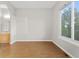 An empty bedroom featuring laminate flooring and a neutral-colored wall at 34427 Columbine W Trl, Elizabeth, CO 80107