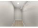 Empty walk-in closet with a wire shelf for storage and neutral carpeting at 34427 Columbine W Trl, Elizabeth, CO 80107