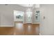 Inviting foyer featuring laminate flooring, decorative lighting, and a clear view of a separate living space at 34427 Columbine W Trl, Elizabeth, CO 80107