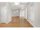 Open-concept living space featuring pristine laminate flooring and neutral wall paint at 34427 Columbine W Trl, Elizabeth, CO 80107