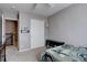 A bright bedroom with convenient closet space and a view of the staircase at 5683 Raleigh Cir, Castle Rock, CO 80104