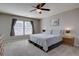 Spacious bedroom featuring neutral decor, large windows, and a ceiling fan at 5683 Raleigh Cir, Castle Rock, CO 80104