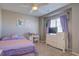 Bright bedroom with a ceiling fan, desk, and a television on a dresser at 5683 Raleigh Cir, Castle Rock, CO 80104