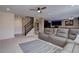 Open-concept living room with modern furnishings and seamless flow to the kitchen and dining area at 5683 Raleigh Cir, Castle Rock, CO 80104