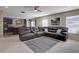Inviting living room with plush seating, large windows, and an open layout at 5683 Raleigh Cir, Castle Rock, CO 80104