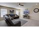 Bright living room featuring plush seating, neutral paint, and ample natural light at 5683 Raleigh Cir, Castle Rock, CO 80104