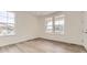 Bedroom features durable floors and large windows at 10727 Snowdon St, Parker, CO 80134
