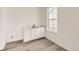 Mudroom features durable floors, window, and utility sink at 10727 Snowdon St, Parker, CO 80134